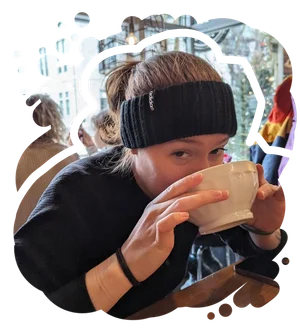 Goofy lady drinking coffee.